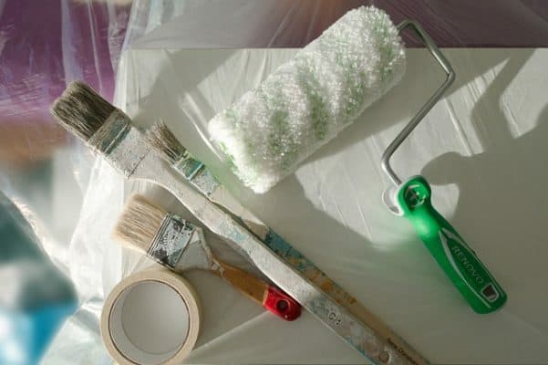 How To Paint Baseboards: picture of painters equipment, painter's tape, paintbrushes and roller