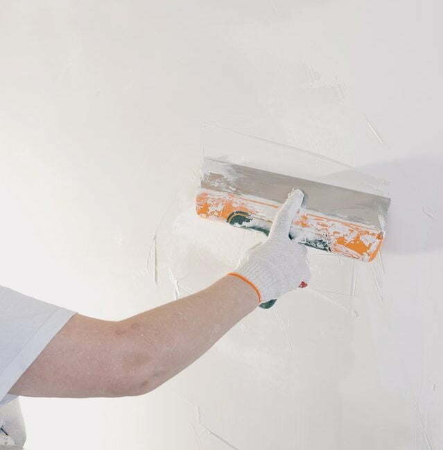 Preparing the wall, covering holes and dents