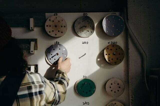 a man choosing what sand paper is best