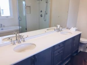 A grey set of bathroom cabinets