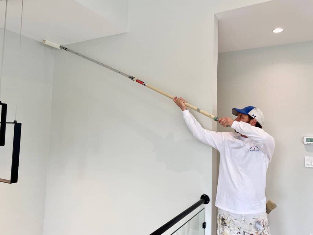 Painting a ceiling with a paint roller