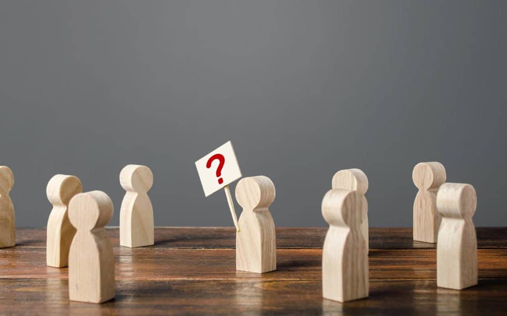 A group of people waiting to ask questions