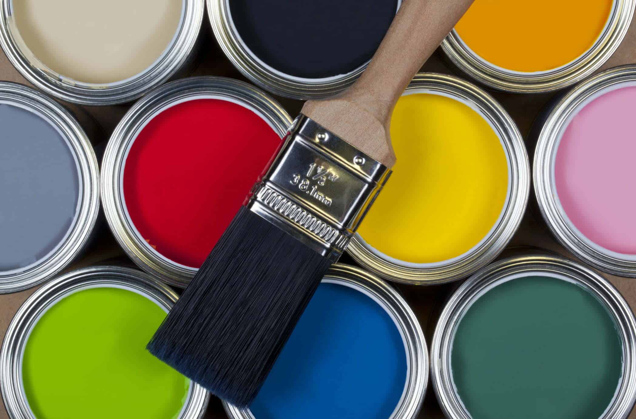 Several tins of paint for article difference between interior and exterior paint