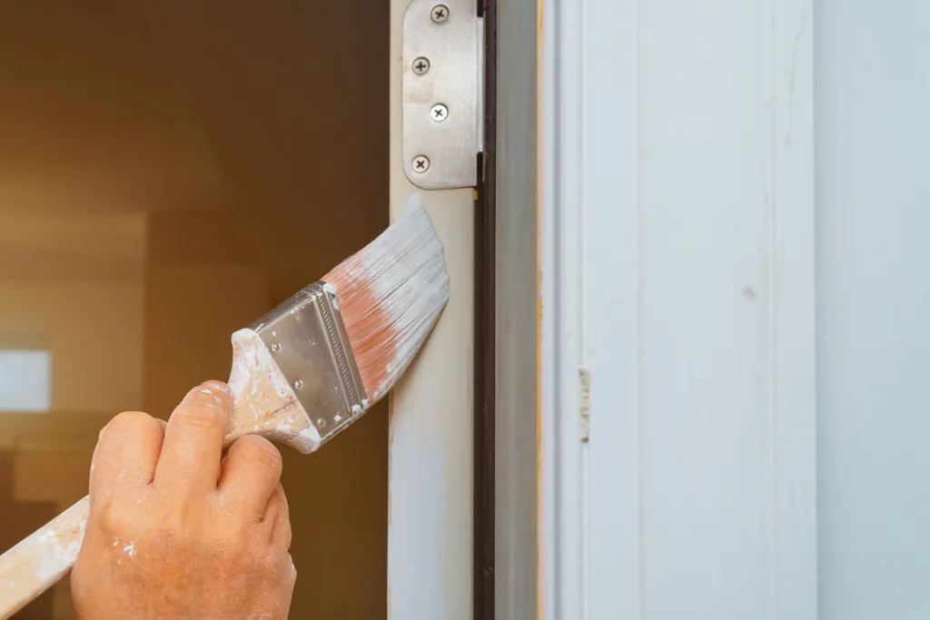 house painter working on house