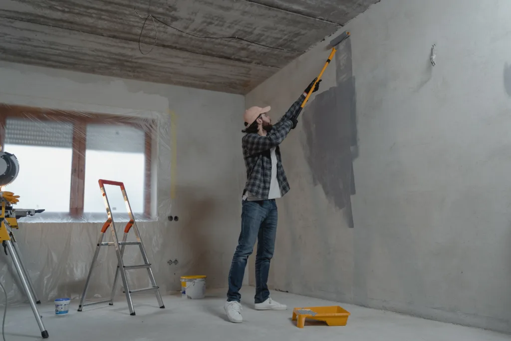 Man painting the house